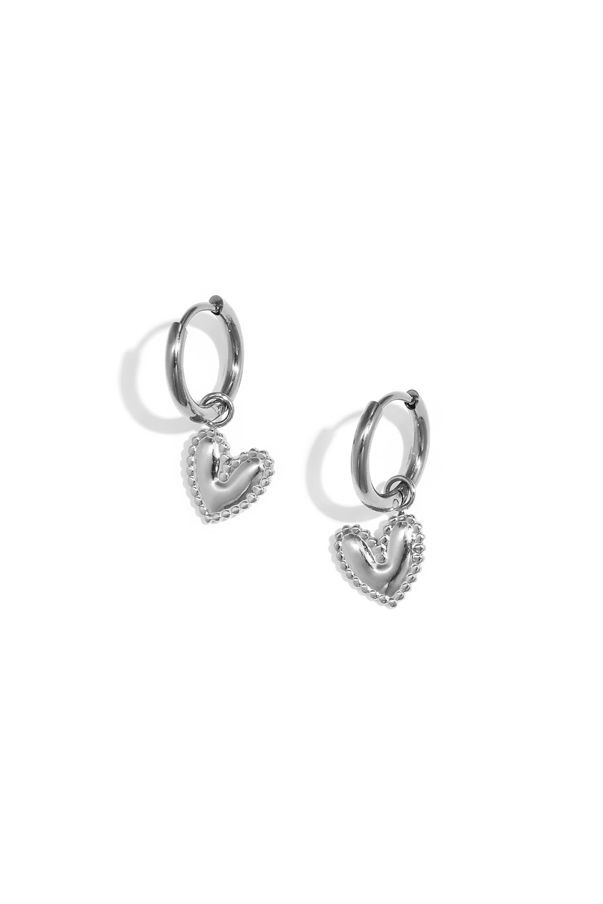 Earrings with a detailed dangling heart